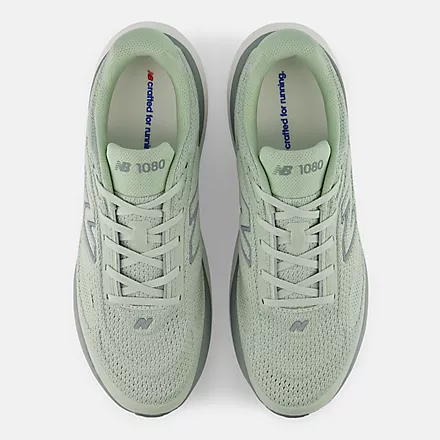 New Balance 1080v15 running shoes in light green with engineered mesh upper, top view showing lace system.