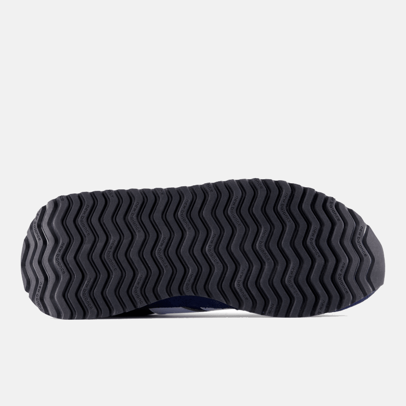 New Balance 237 sneakers outsole with a black rubber sole featuring a wave pattern for enhanced traction, bottom view.