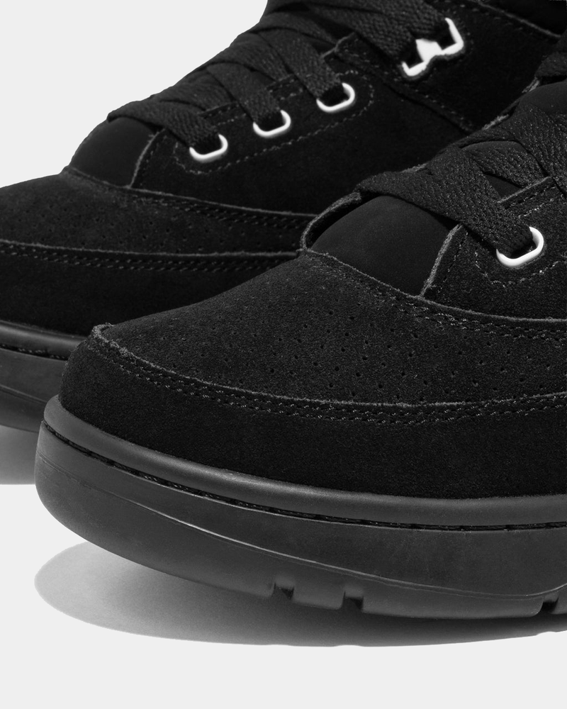 Ewing Athletics 33 HI OG sneakers in black suede with perforated details, sturdy black sole, and secure lace-up design, close-up front view.