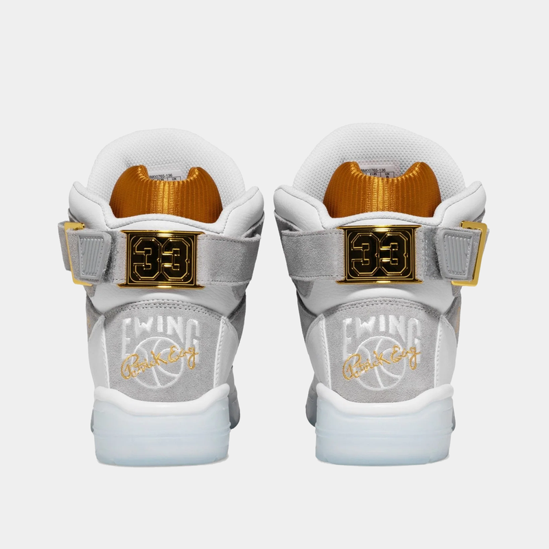 Ewing Athletics 33 HI x LAURENS J sneakers in white and gray with gold accents, back view showing embroidered branding and gold "33" details.