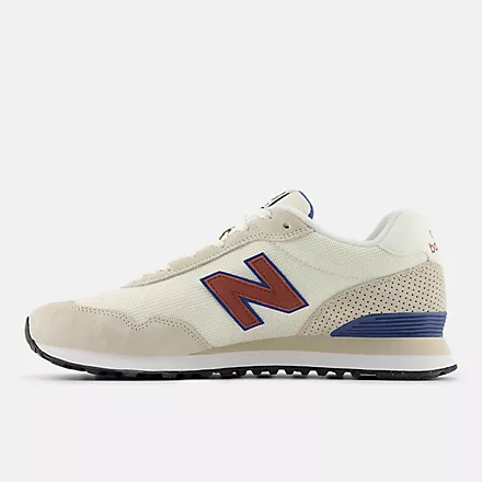 New Balance 515 v3 sneakers in beige and blue with suede overlays and perforated heel, side view.