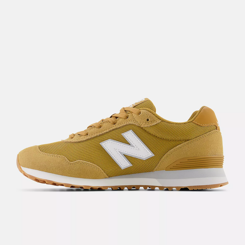 New Balance 515 v3 sneakers in mustard yellow with a white logo, suede overlays, and mesh upper, side view.