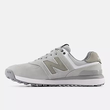 New Balance Golf 574 Greens v2 golf shoes in light gray with synthetic upper, cushioned midsole, and spiked outsole, side view.
