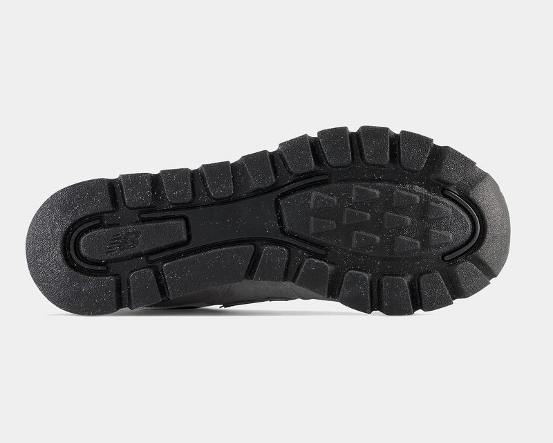 New Balance 574 Rugged shoes outsole in black rubber with deep lugged traction pattern, bottom view.