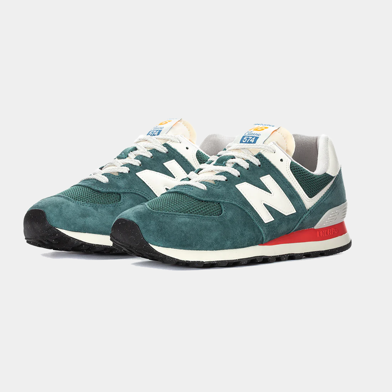 New Balance 574 sneakers in green suede and white mesh panels with red ENCAP midsole, front-side angled view.