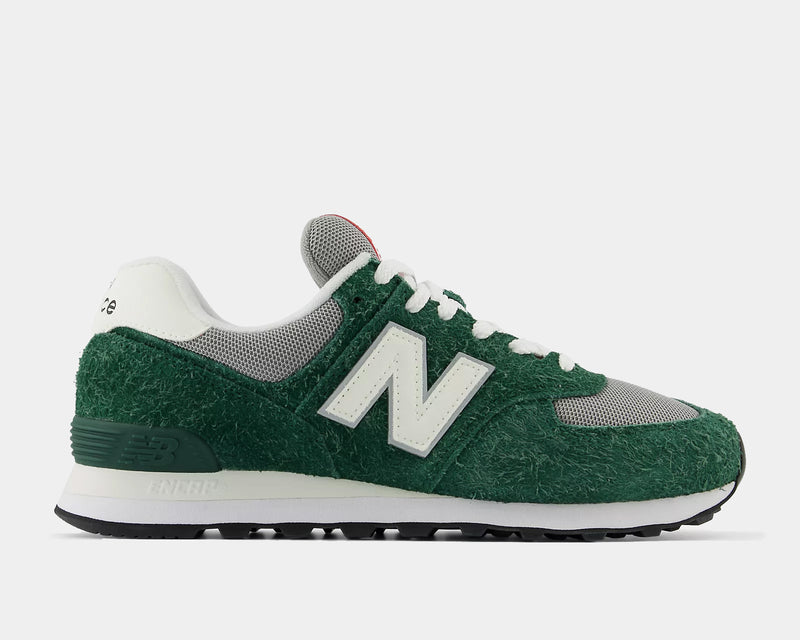 New Balance 574 sneakers featuring green hairy suede upper, gray mesh accents, white "N" logo, and ENCAP midsole, side view.