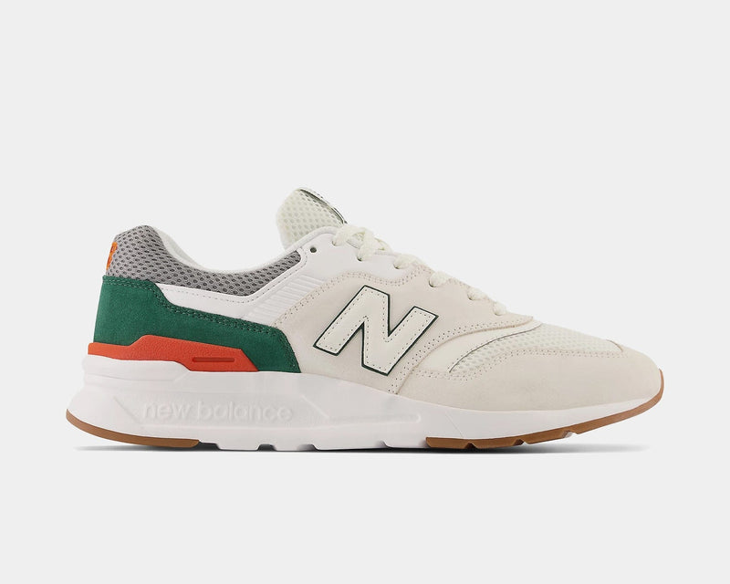 New Balance 997H sneakers in off-white with green suede accents, orange detailing, and a gum outsole, side view.