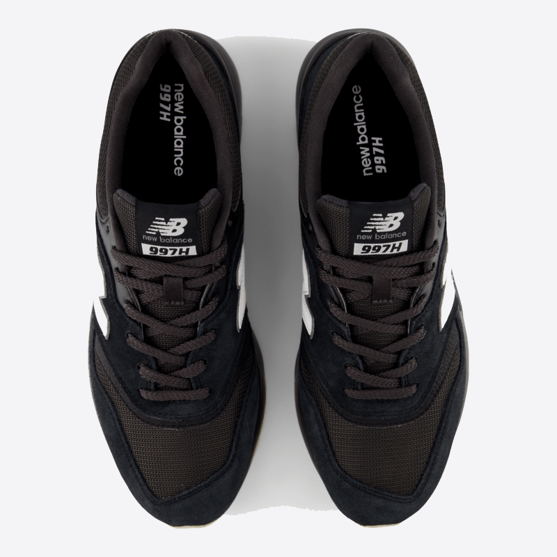 New Balance 997H sneakers in black with mesh upper, suede overlays, and white branding, top view.