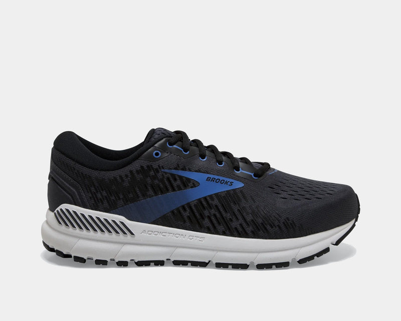 Brooks Addiction GTS 15 running shoes in black with blue accents, GuideRails support system, and mesh upper, side view.