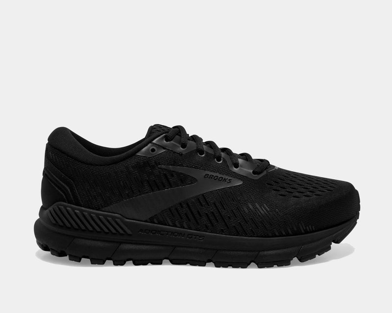 Brooks Addiction GTS 15 running shoes in black with engineered mesh upper, GuideRails support system, and cushioned sole, side view.
