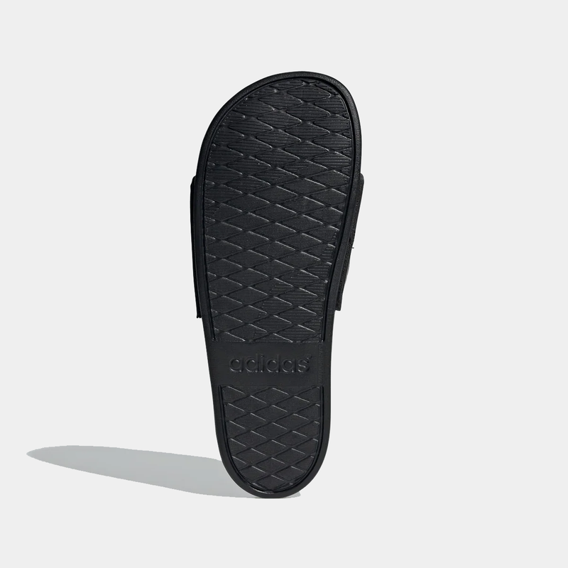 Adidas Adilette Comfort Slides black sole with textured grip and embossed logo, sole/bottom view