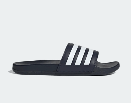 Adidas Adilette Comfort slides in navy blue with white signature three-stripe design, side view.