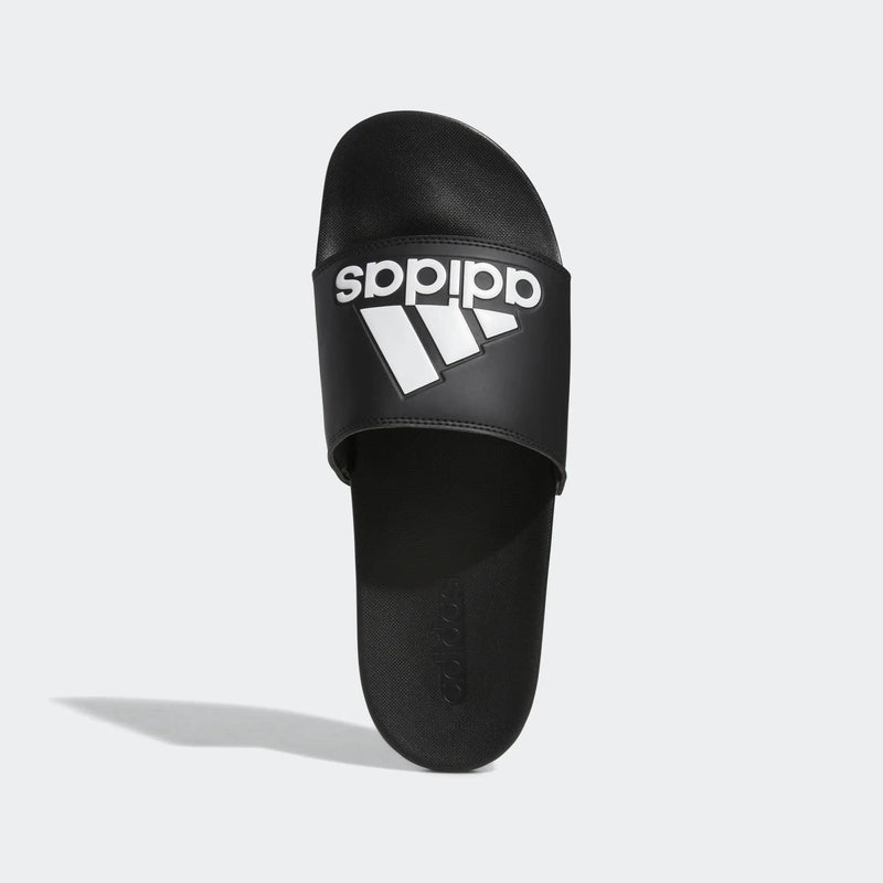 Adidas Adilette Comfort slide sandals in black with white logo branding, top view showing cushioned footbed and single strap.