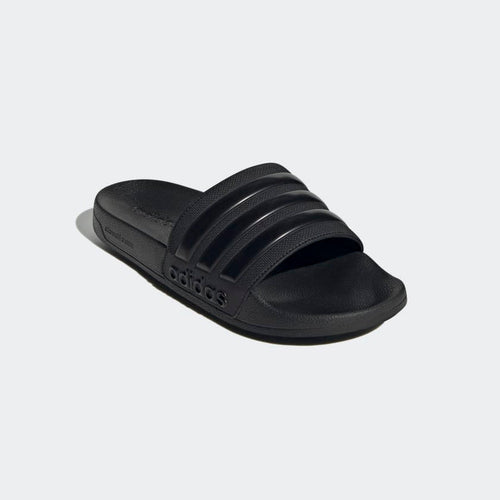 Adidas Adilette Shower Slides in black with textured strap and molded footbed, angled front view.