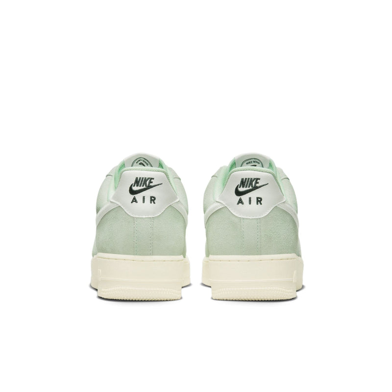 Nike Air Force 1 '07 LV8 shoes, back view showing mint green suede upper, white heel tab with black Nike Air logo, and cream midsole