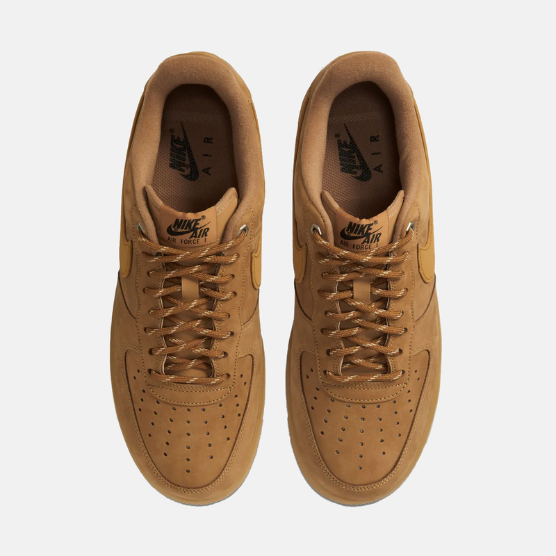 Pair of brown Nike Air sneakers on a white background