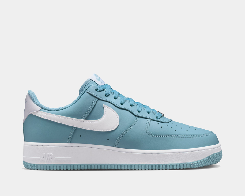Nike Air Force 1 '07 sneakers in blue and white with leather upper, perforated toe box, and signature Swoosh logo, side view.