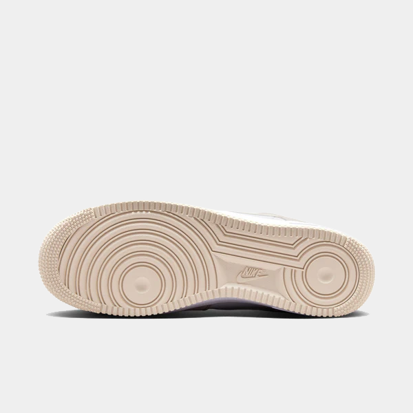 Nike Air Force 1 '07 sneakers outsole in beige with circular tread pattern and Nike logo, bottom view.