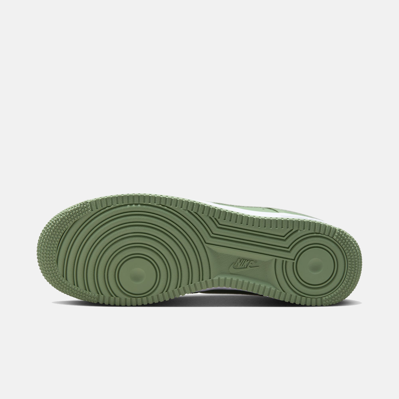 Nike Air Force 1 '07 sneakers outsole in light green rubber with circular tread patterns and Nike logo.