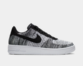 Nike Air Force 1 Flyknit 2.0 sneakers featuring black and white Flyknit upper, black Nike Swoosh, and white midsole, side view.