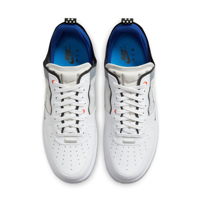 Nike Air Force 1 React sneakers in white with perforated toe box, black and gray accents, and blue insoles, top view.