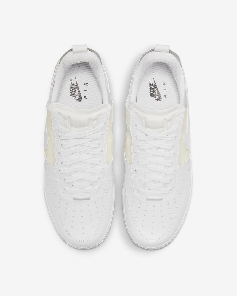 Nike Air Force 1 React sneakers in white with perforated toe box, React foam midsole, and lace-up design, top view.