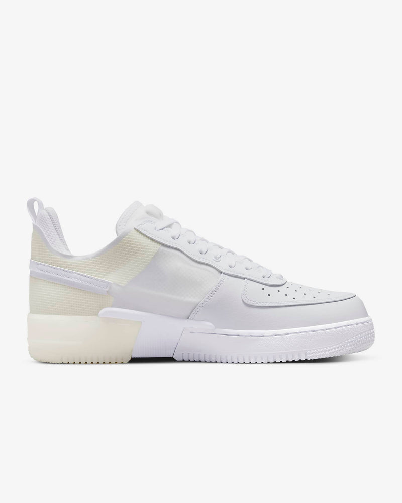 Nike Air Force 1 React sneakers in white and translucent materials with textured midsole and React cushioning, side view.