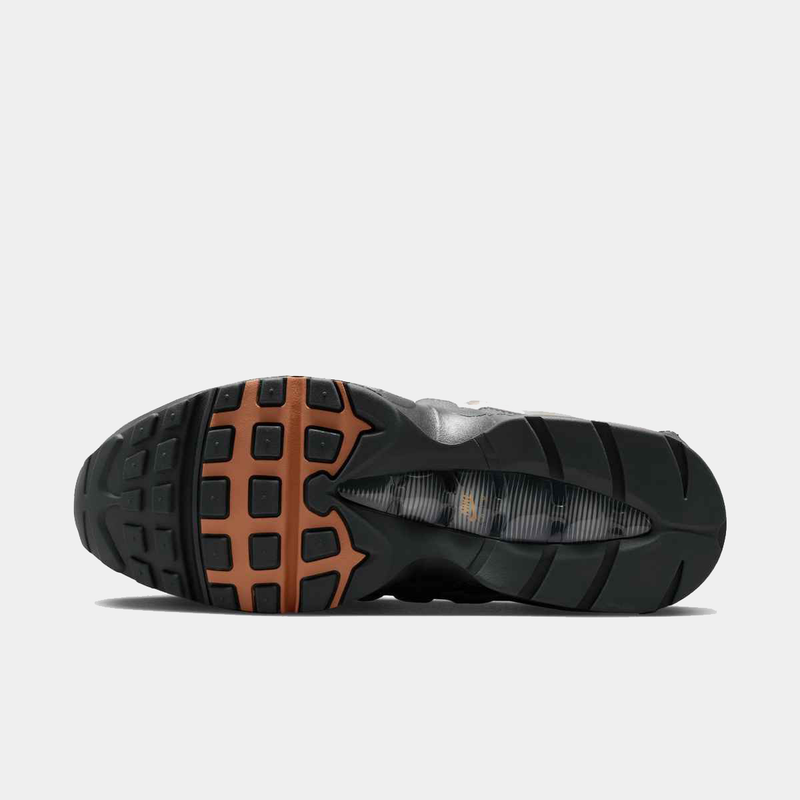 Nike Air Max 95 Big Bubble OG sneakers, black and orange rubber outsole, bottom view.