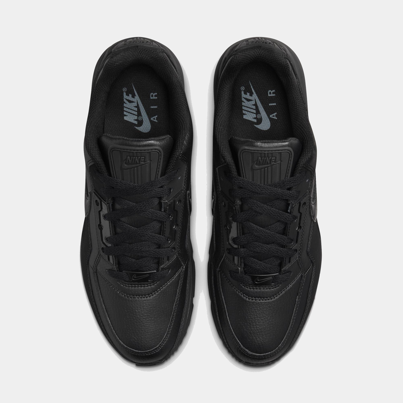 Black Nike Air sneakers on a white background