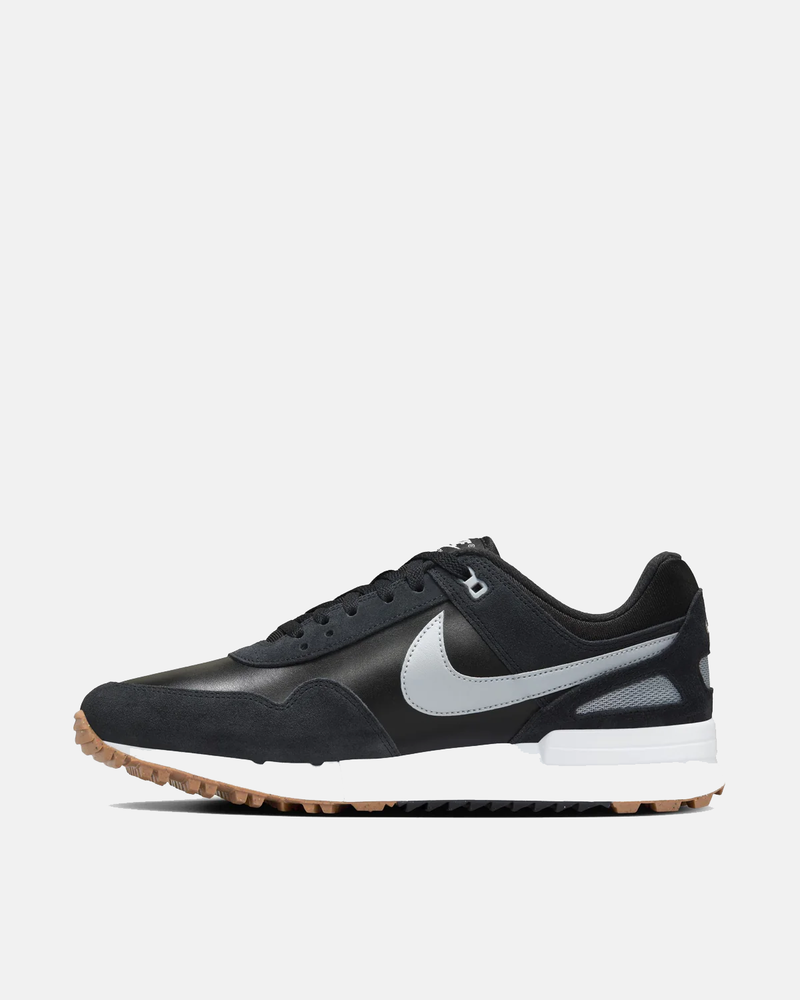Nike Air Pegasus 89' G sneakers in black with gray accents, suede overlays, and a gum outsole, side view.