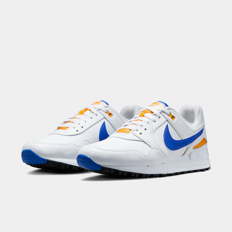 Nike Air Pegasus 89' G sneakers in white with blue Swoosh and orange accents, front angle view.