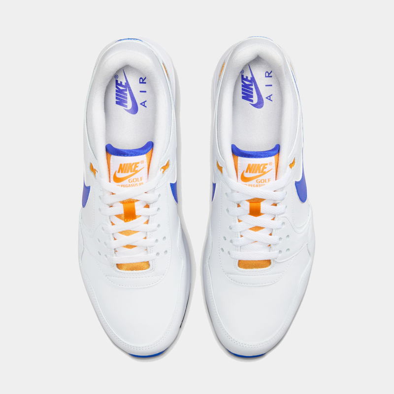 Nike Air Pegasus 89' G sneakers in white with blue accents, orange tongue detailing, and classic lace-up design, top view.