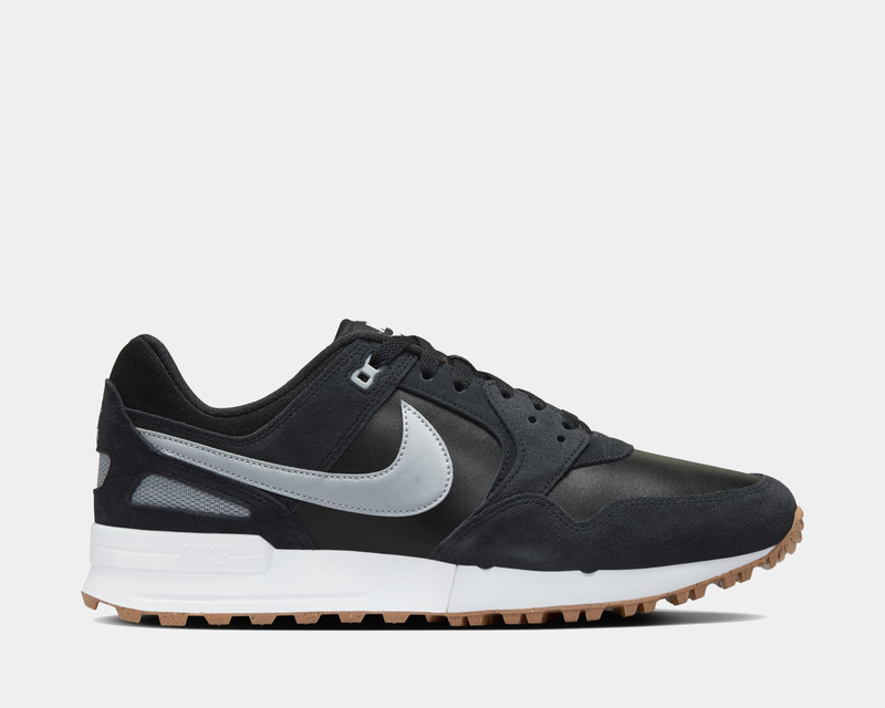 Nike Air Pegasus 89' G sneakers in black with suede overlays, silver Swoosh logo, leather accents, and gum outsole, side view.