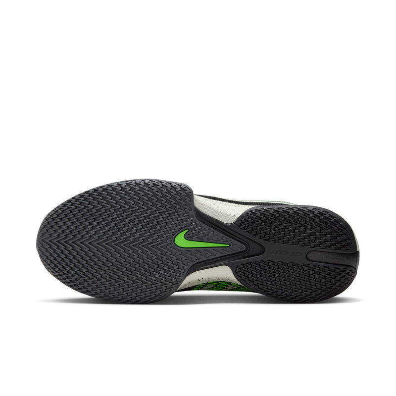 Nike Air Zoom G.T. Cut Academy basketball shoes outsole showing herringbone traction pattern in black with green Nike logo.