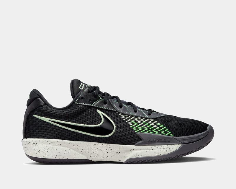 Nike Air Zoom G.T. Cut Academy basketball shoes, side view in black with green accents, mesh upper, and speckled white midsole.