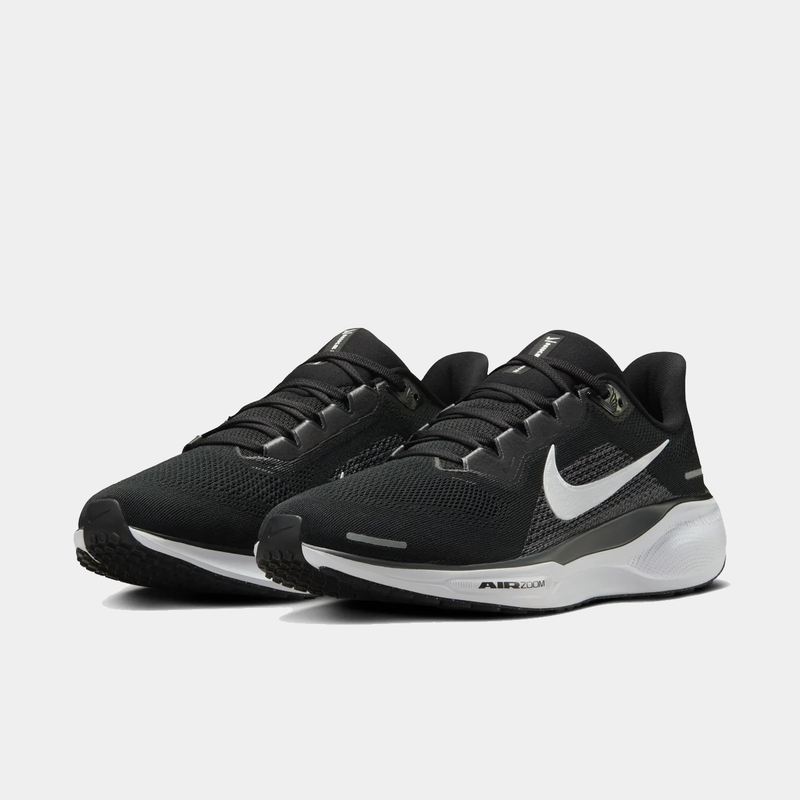 A pair of black and white Nike Air Zoom Pegasus 41 running shoes with red accents on a white background.