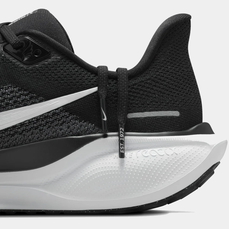 A pair of black and white Nike Air Zoom Pegasus 41 running shoes w on a white background.