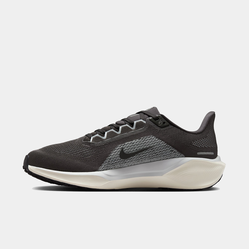 Black and gray running shoe with Nike logo on a white background