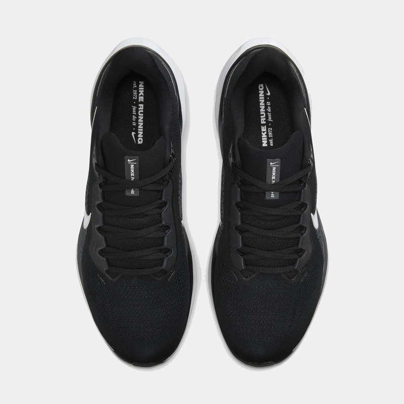 A pair of black and white Nike Air Zoom Pegasus 41 running shoes n a white background.