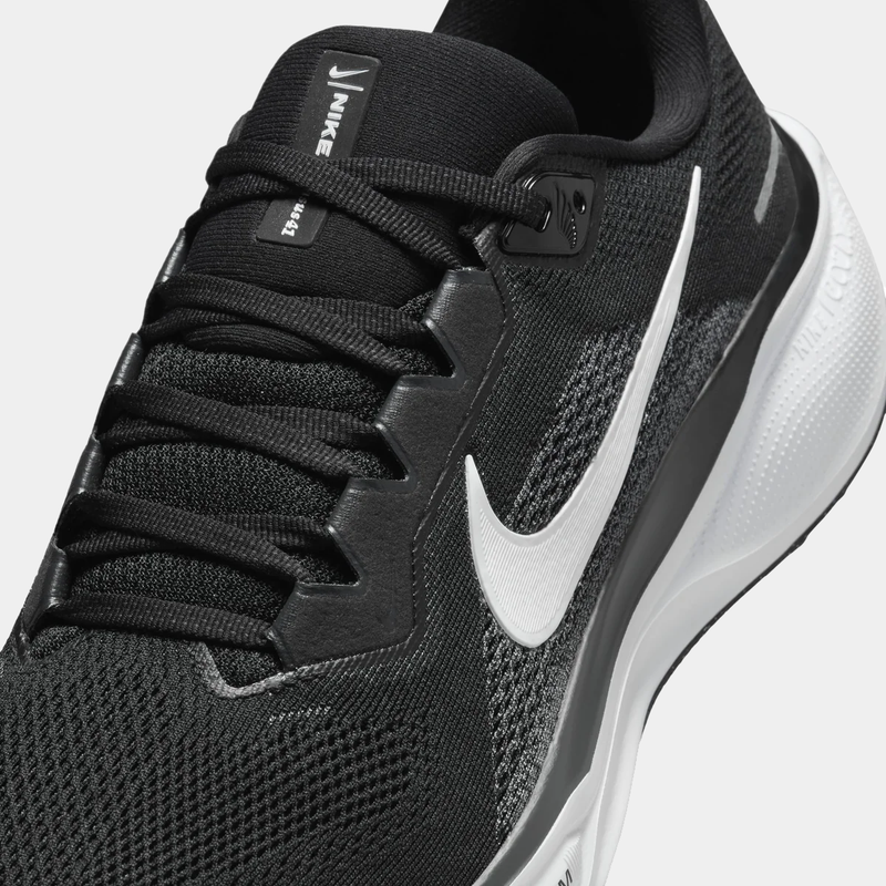 A pair of black and white Nike Air Zoom Pegasus 41 running shoes on a white background.