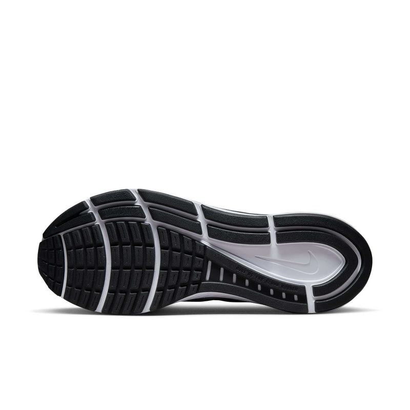 Nike Air Zoom Structure 24 running shoe outsole in black and white rubber with traction patterns and Nike logo, sole/bottom view.
