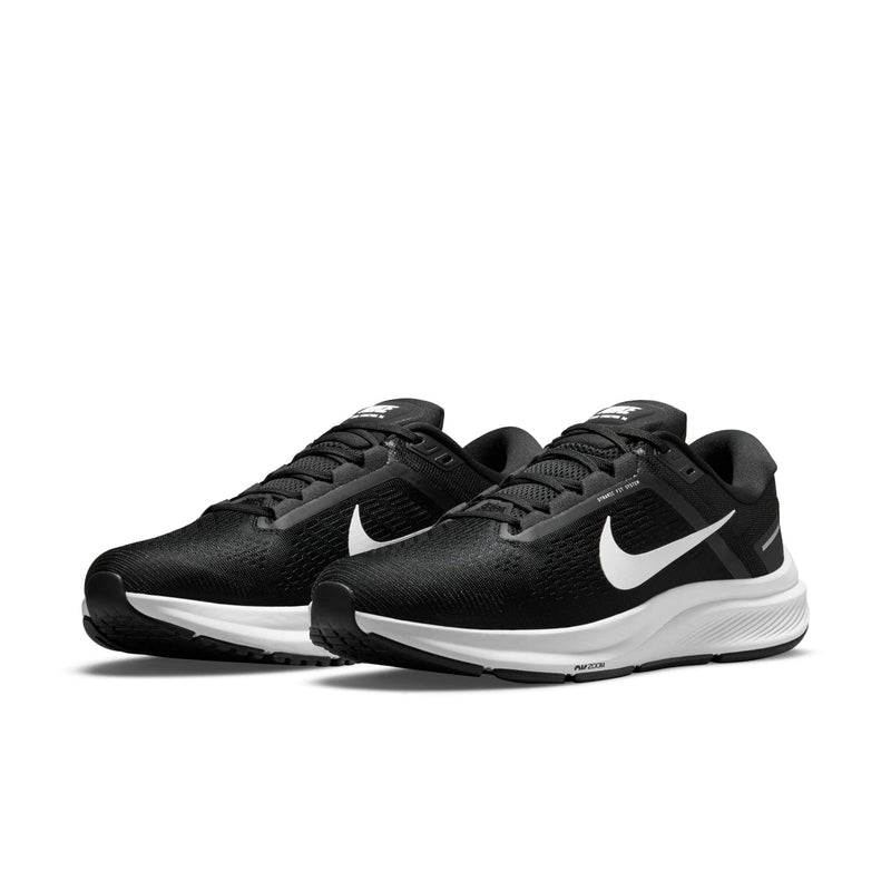 Nike Air Zoom Structure 24 running shoes in black with white Nike Swoosh, breathable mesh upper, and cushioned midsole, front angle view.