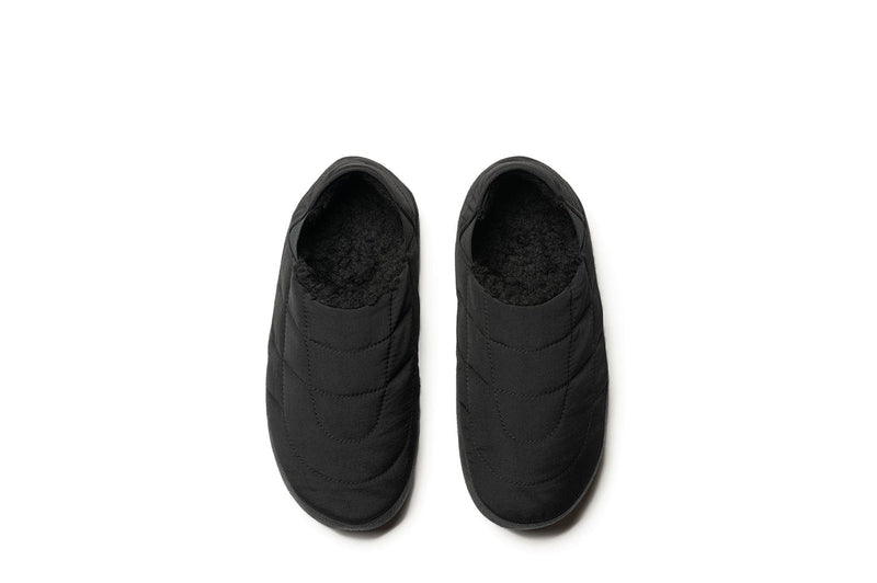 SeaVees Apres Puff Slip On shoes in solid black with quilted puff upper and fleece lining, top view.