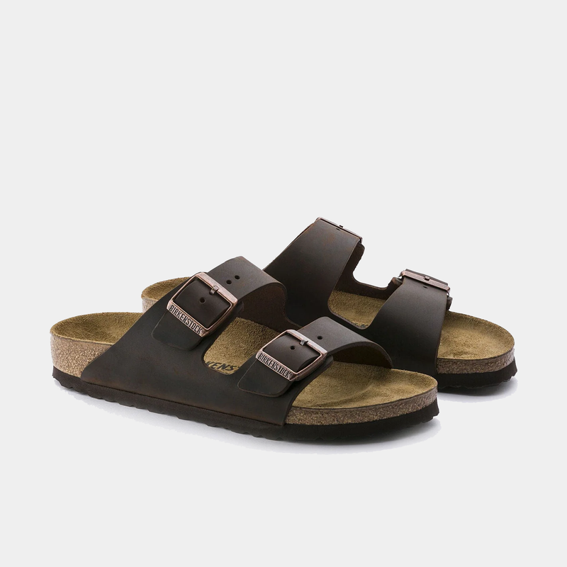 Birkenstock Arizona Oiled Leather sandals in dark brown with adjustable buckles and cork footbed, front angle view.