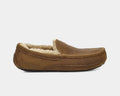 UGG Ascot Matte Leather slippers in brown matte leather with stitched detailing and plush shearling lining, side view.