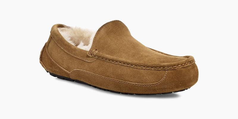 UGG Ascot Suede moccasin slippers in chestnut brown suede with soft wool lining and durable rubber sole, side angle view.
