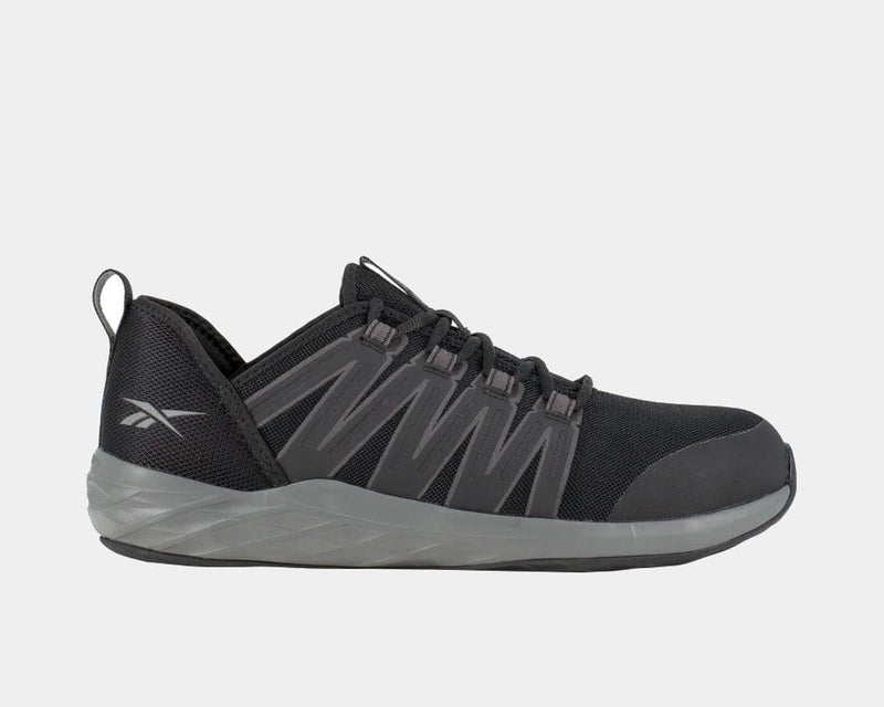 Reebok Work Astroride Work shoes in black with gray accents, mesh upper, reinforced toe, and durable outsole, side view.