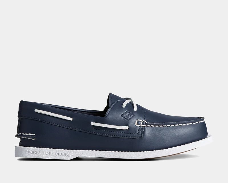 Sperry Authentic Original™ Boat Shoe in navy leather with white contrast stitching and laces, side view showing moccasin toe and non-slip sole.