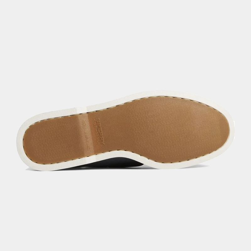Sperry Authentic Original™ Cross Lace shoe outsole showing tan rubber tread with white stitching edge detailing.