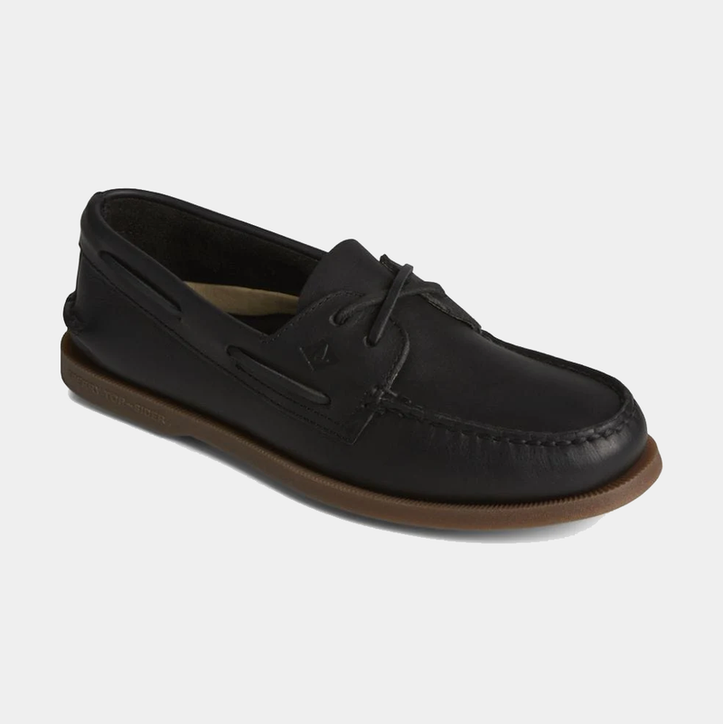 Sperry Authentic Original™ Cross Lace boat shoe in black leather with moc-toe stitching and brown rubber sole, angled side view.
